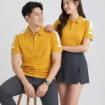 Áo Polo Đồng Phục Màu Vàng Cúc Cầu Vai Trắng