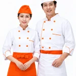 Áo bếp đồng phục màu trắng tay lửng phối cam 2 hàng khuy